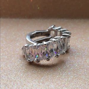 Simulated white gemstone hoop earrings.